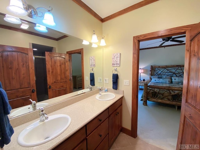 bathroom with ornamental molding, tile patterned floors, ceiling fan, and vanity