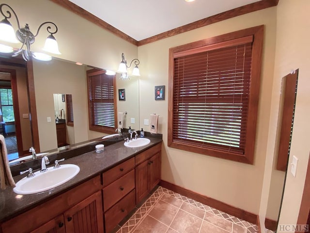 bathroom with tile patterned flooring, vanity, and an inviting chandelier