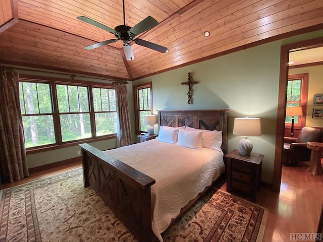 bedroom featuring vaulted ceiling, wooden ceiling, ceiling fan, and light wood-type flooring