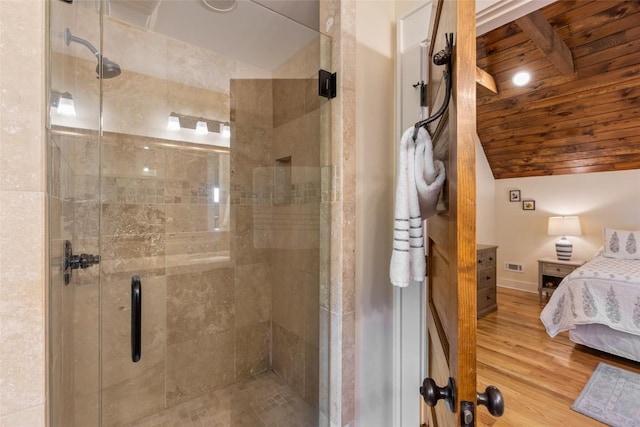 50 Bluestar Way, Glenville, NC 28736 - ensuite bathroom with a stall shower, wood finished floors, and vaulted ceiling