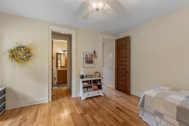 50 Bluestar Way, Glenville, NC 28736 - bedroom with light wood-style floors, a ceiling fan, and ensuite bath