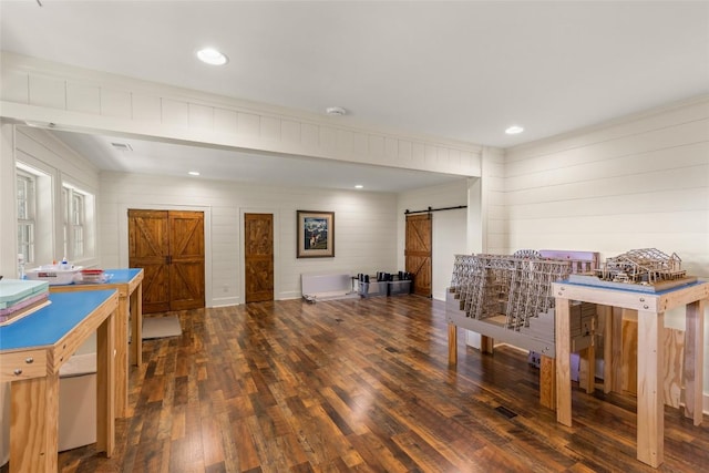 50 Bluestar Way, Glenville, NC 28736 - playroom featuring a barn door, wood finished floors, and wood walls