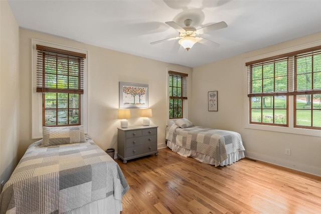 50 Bluestar Way, Glenville, NC 28736 - bedroom with light wood-type flooring and ceiling fan