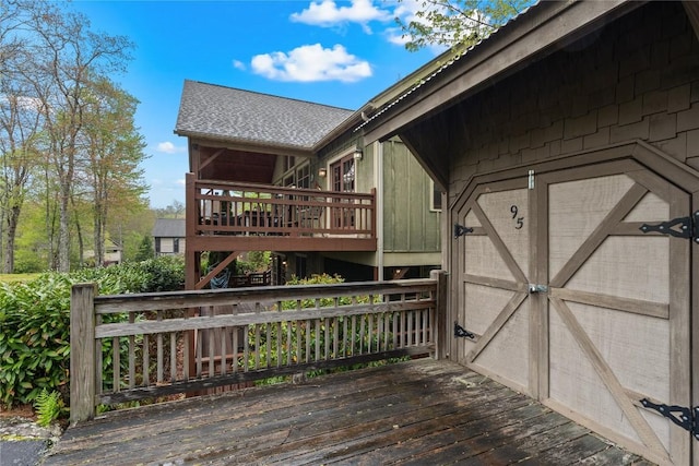 deck with a storage shed and an outdoor structure