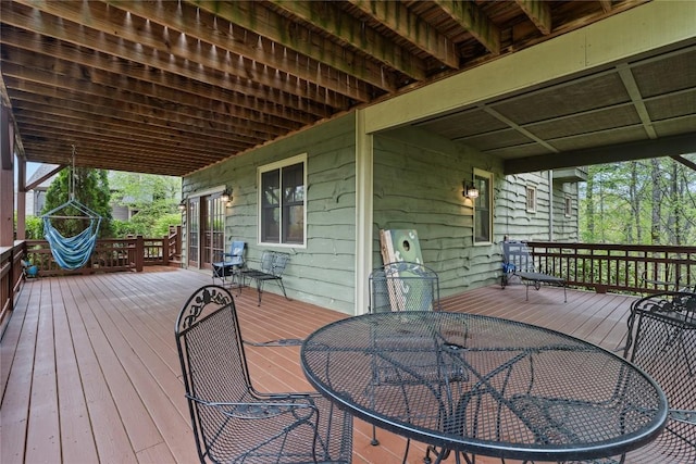deck featuring outdoor dining area