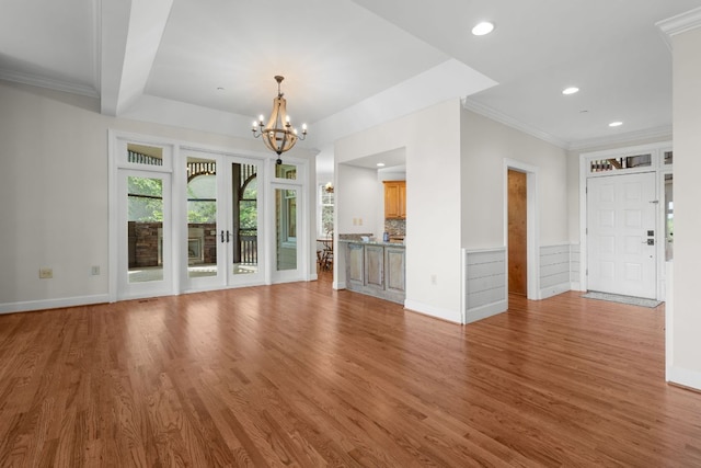 410C Highlands Cove Dr Unit 1300C, Highlands, NC 28741 - unfurnished living room with a chandelier, wood finished floors, crown molding, recessed lighting, and a wainscoted wall