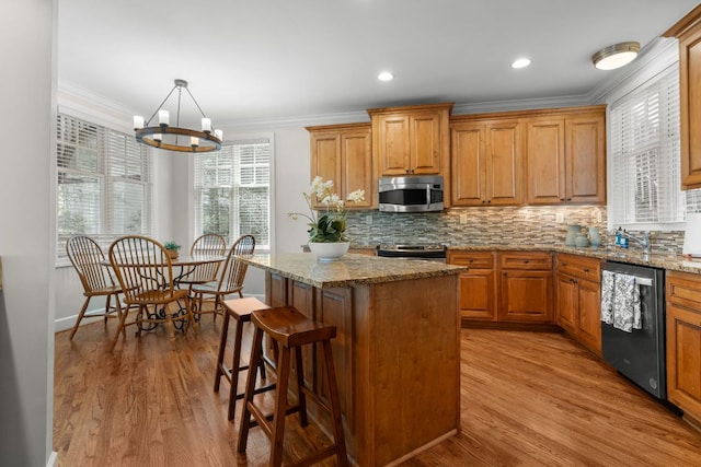 410C Highlands Cove Dr Unit 1300C, Highlands, NC 28741 - kitchen featuring stainless steel appliances, crown molding, backsplash, a kitchen island, and a chandelier