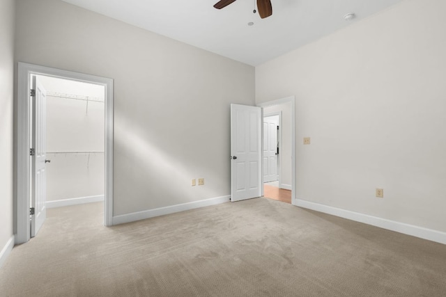 410C Highlands Cove Dr Unit 1300C, Highlands, NC 28741 - unfurnished bedroom featuring carpet flooring, a walk in closet, a closet, and a ceiling fan