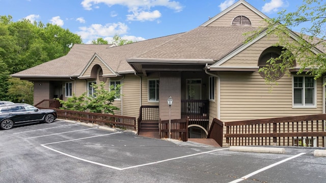 410C Highlands Cove Dr Unit 1300C, Highlands, NC 28741 - view of front facade featuring uncovered parking and a shingled roof