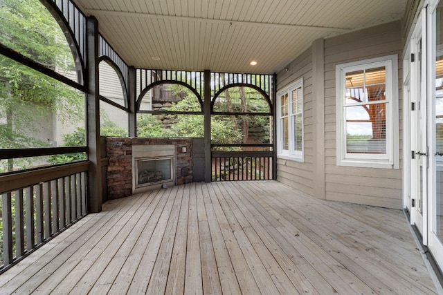 410C Highlands Cove Dr Unit 1300C, Highlands, NC 28741 - unfurnished sunroom with a stone fireplace
