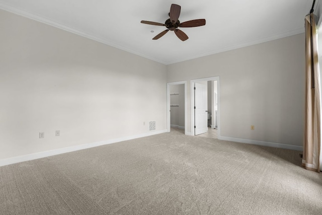 410C Highlands Cove Dr Unit 1300C, Highlands, NC 28741 - unfurnished bedroom with light colored carpet, crown molding, a spacious closet, ceiling fan, and connected bathroom