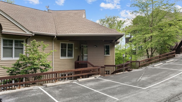 410C Highlands Cove Dr Unit 1300C, Highlands, NC 28741 - doorway to property with uncovered parking and roof with shingles