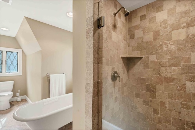 bathroom featuring toilet, a stall shower, and visible vents