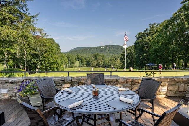 49 Hickory Ln, Highlands, NC 28741 - wooden terrace featuring outdoor dining area, a forest view, and a mountain view