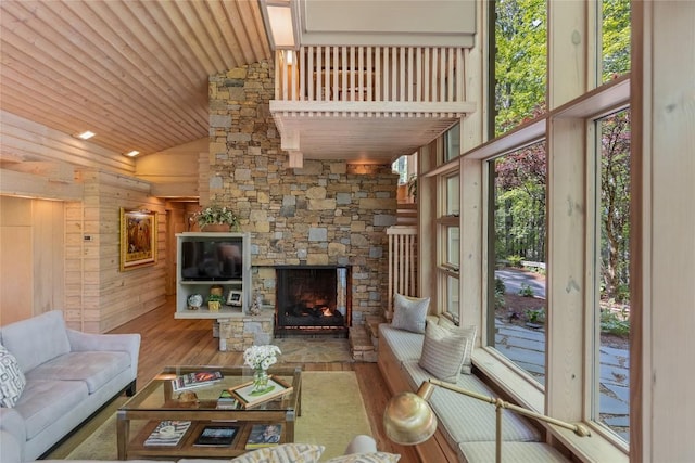 49 Hickory Ln, Highlands, NC 28741 - living room with wood finished floors, plenty of natural light, wooden ceiling, high vaulted ceiling, and a fireplace