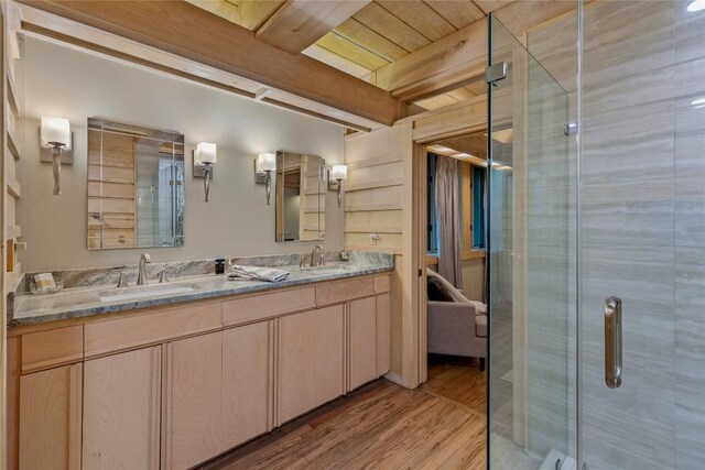 49 Hickory Ln, Highlands, NC 28741 - ensuite bathroom featuring double vanity, wood finished floors, and a shower stall