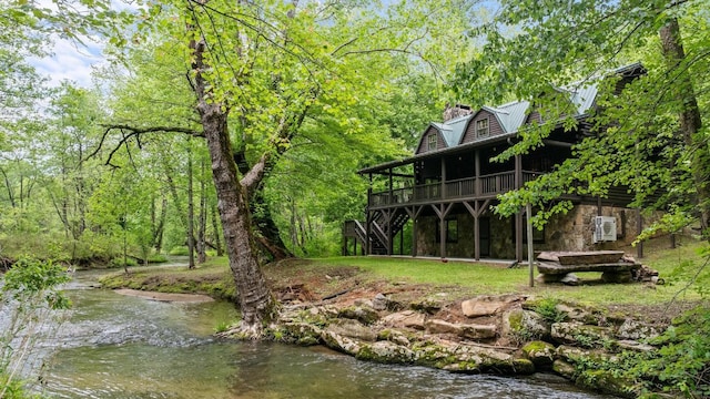 130 Sarah Cove Rd, Otto, NC 28763 - rear view of house with stairway, a deck, metal roof, stone siding, and a chimney