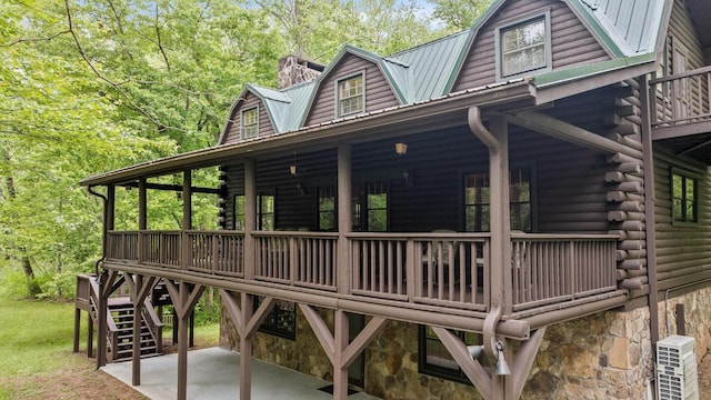 130 Sarah Cove Rd, Otto, NC 28763 - back of house with log siding, metal roof, a patio, and stairs