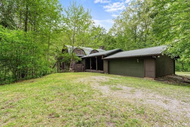 130 Sarah Cove Rd, Otto, NC 28763 - view of grassy yard with a garage and driveway