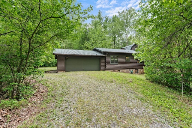 130 Sarah Cove Rd, Otto, NC 28763 - rear view of house with driveway, a garage, and metal roof