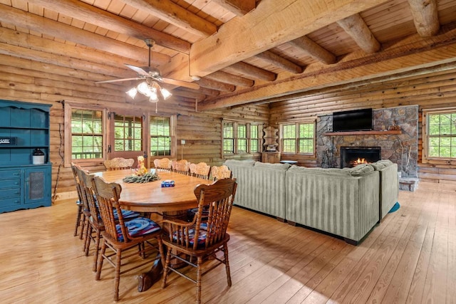 130 Sarah Cove Rd, Otto, NC 28763 - dining room featuring wood ceiling with exposed beams, light wood-type flooring, a fireplace, and ceiling fan