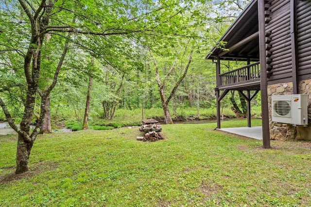 130 Sarah Cove Rd, Otto, NC 28763 - view of grassy yard with ac unit, a patio area, and a forest view