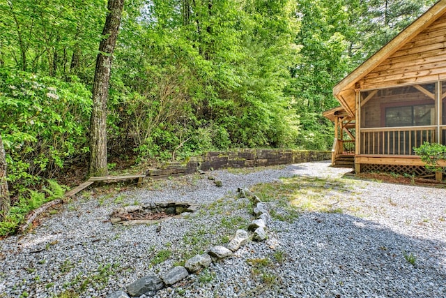 142 Golden Mist Ct, Sapphire, NC 28774 - view of yard featuring a sunroom and a wooded view