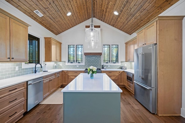 kitchen with dark wood-style floors, a center island, custom range hood, a sink, and stainless steel appliances