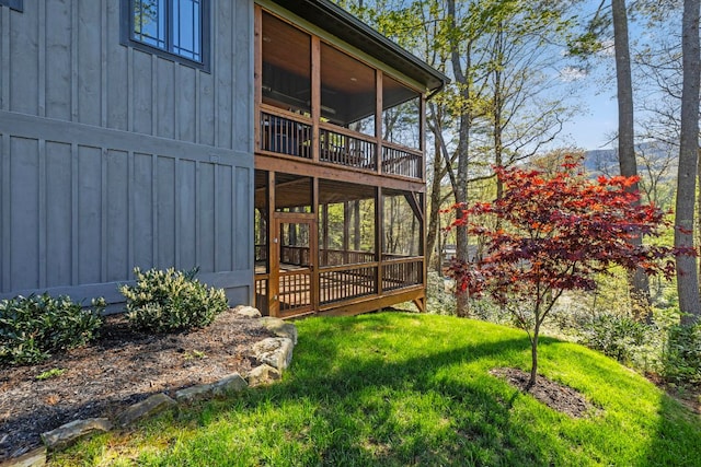 1048 Cherokee Trce, Lake Toxaway, NC 28747 - view of green lawn featuring a wooden deck and a sunroom
