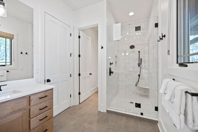 full bathroom with vanity, tile patterned flooring, a stall shower, and recessed lighting