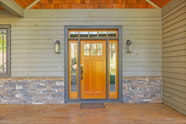 entrance to property with stone siding