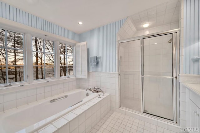 bathroom featuring separate shower and tub and tile patterned flooring