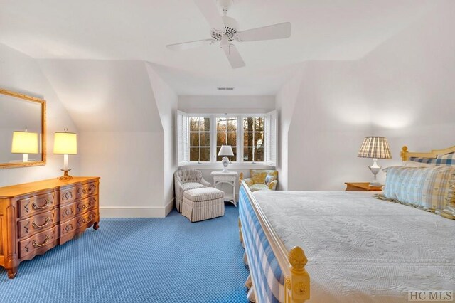 carpeted bedroom featuring ceiling fan and vaulted ceiling