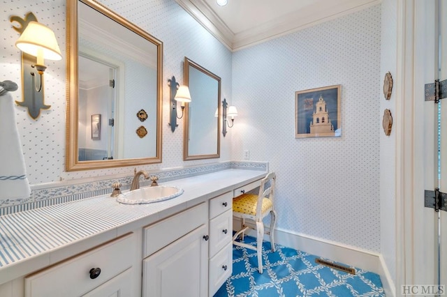 bathroom with crown molding and vanity