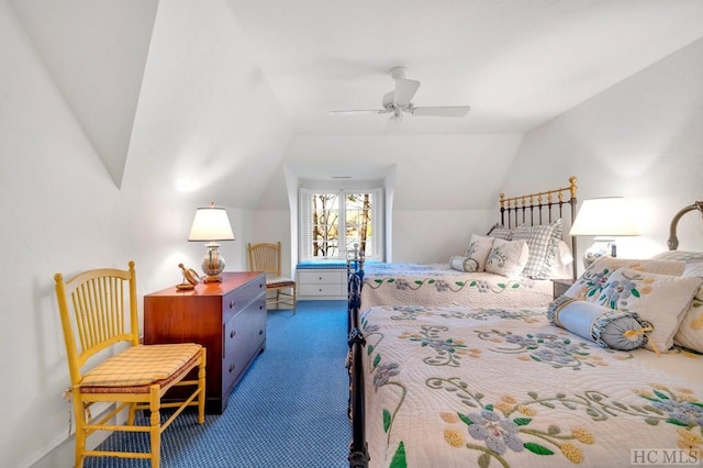 carpeted bedroom featuring vaulted ceiling and ceiling fan