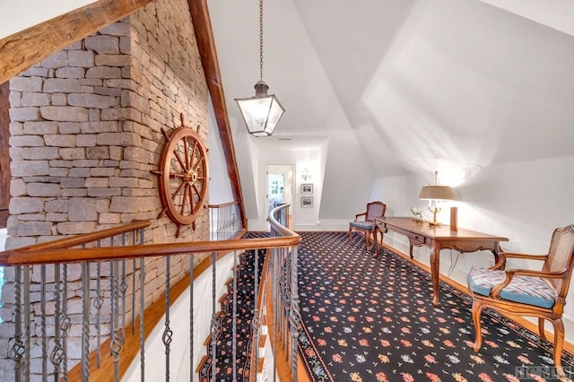 interior space with vaulted ceiling and carpet flooring