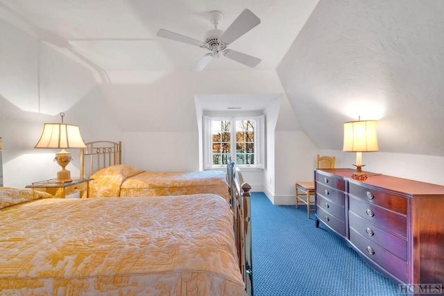 bedroom with vaulted ceiling, ceiling fan, and dark colored carpet