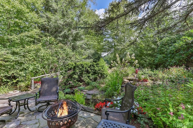 view of patio with an outdoor fire pit