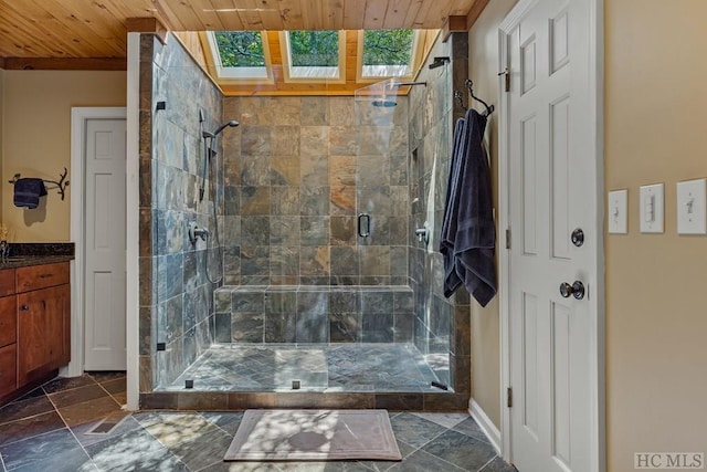 bathroom with a skylight, wooden ceiling, and walk in shower