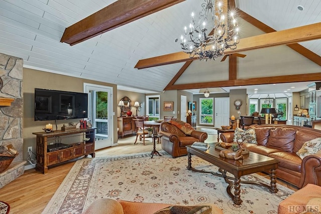 living room featuring a stone fireplace, vaulted ceiling with beams, wood ceiling, and light hardwood / wood-style flooring