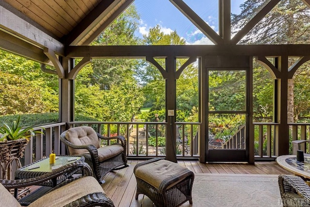 sunroom with a wealth of natural light and vaulted ceiling