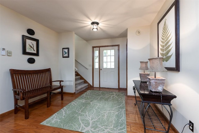 1964 Woods Mountain Trl, Cullowhee, NC 28723 - foyer entrance featuring stairs, wood finished floors, and baseboards