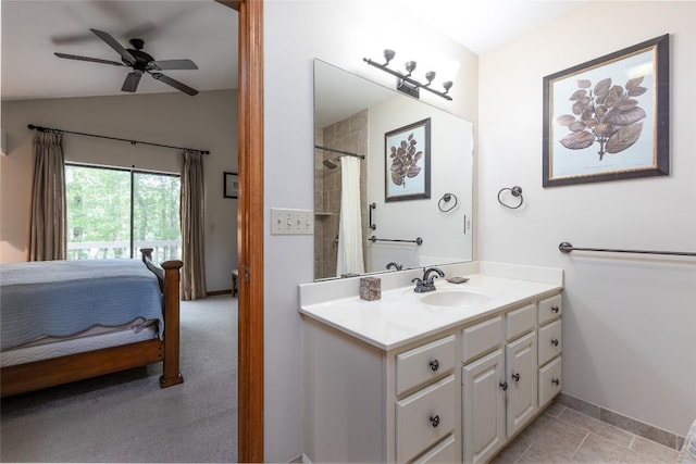 1964 Woods Mountain Trl, Cullowhee, NC 28723 - bathroom with vanity, vaulted ceiling, ceiling fan, and baseboards