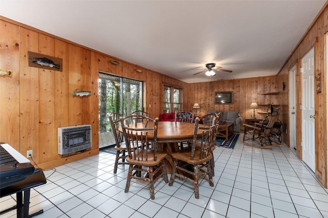 1964 Woods Mountain Trl, Cullowhee, NC 28723 - dining space featuring heating unit, wood walls, ceiling fan, and light tile patterned floors
