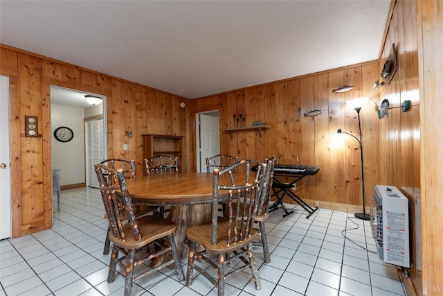 1964 Woods Mountain Trl, Cullowhee, NC 28723 - dining room with wooden walls, light tile patterned floors, heating unit, and baseboards