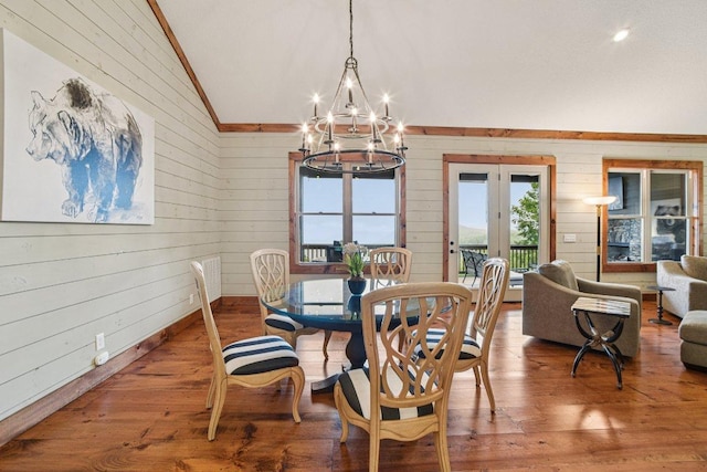 71 Raptor Way, Sapphire, NC 28774 - dining area featuring french doors, lofted ceiling, a chandelier, wooden walls, and wood finished floors