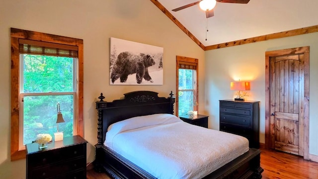 71 Raptor Way, Sapphire, NC 28774 - bedroom with vaulted ceiling, wood finished floors, multiple windows, and a ceiling fan