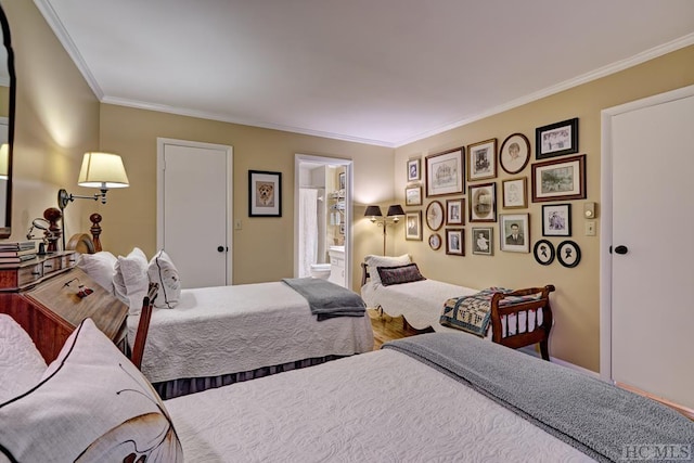 bedroom featuring ornamental molding and connected bathroom