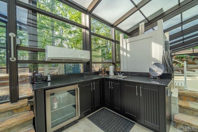 interior space featuring a wall mounted air conditioner, an outdoor kitchen, sink, and beverage cooler