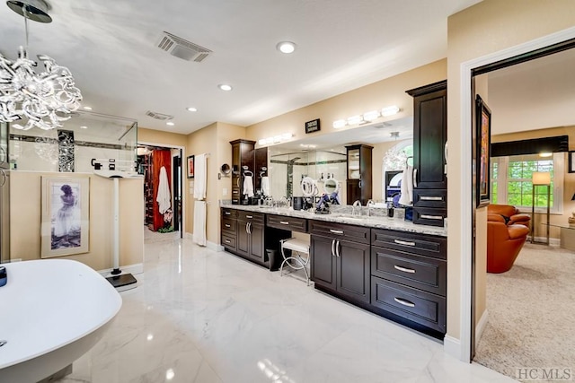 bathroom with vanity and independent shower and bath